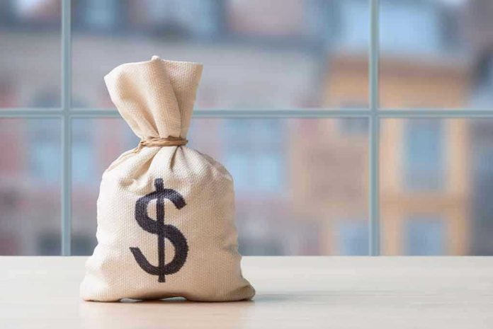 Money bag with dollar sign on table