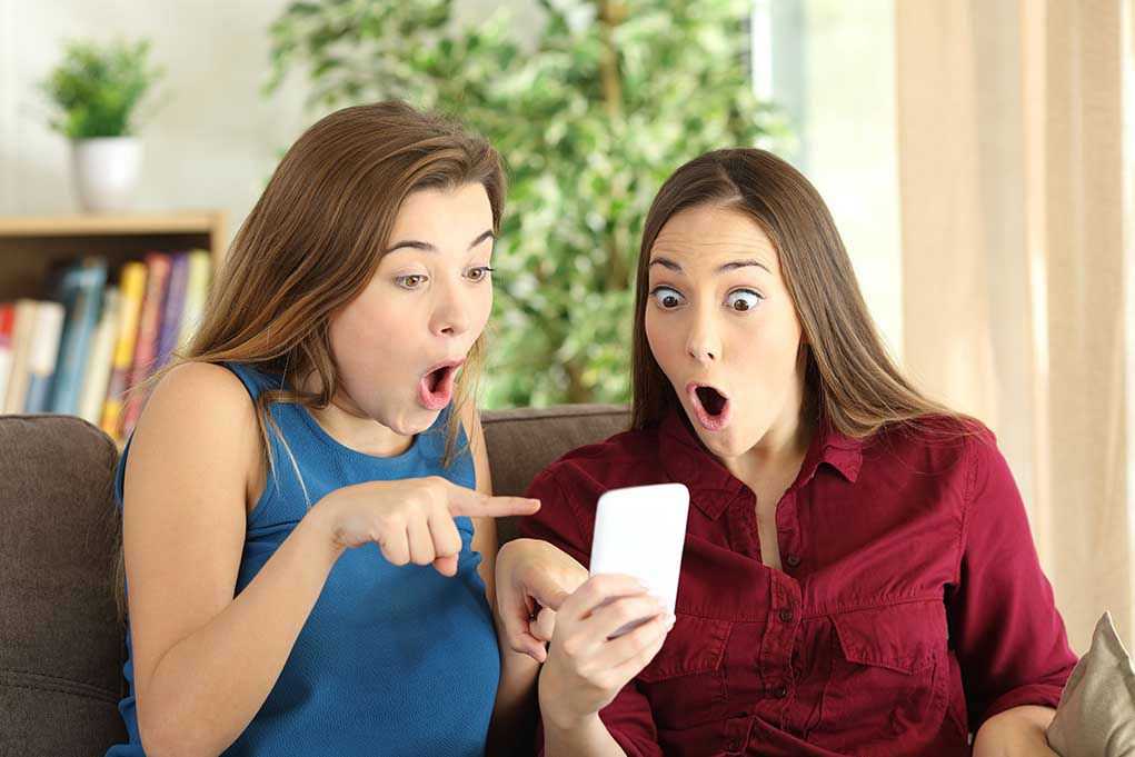 Unbelievable Office Ally: Could This Be Your Career Gold? Two women look surprised at a phone