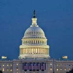 US Capitol building illuminated at dusk