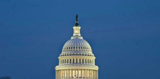 US Capitol building illuminated at dusk
