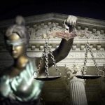 Blindfolded Lady Justice with scales Supreme Court background