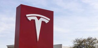 Tesla sign in front of dealership