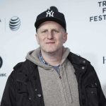 Man wearing a New York Yankees cap and casual clothing at a film festival
