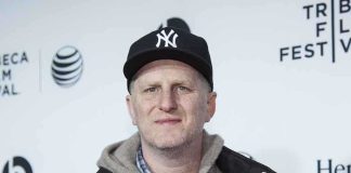 Man wearing a New York Yankees cap and casual clothing at a film festival