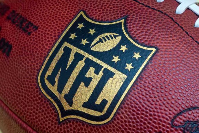 shutterstock_212182807.jpg Close-up of an NFL football with the logo prominently displayed
