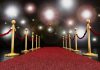 Hollywood’s Shocking Decline: Cultural Crisis Looms A red carpet lined with gold stanchions and ropes under bright spotlights