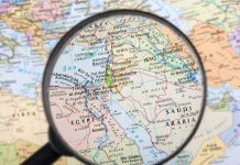 Magnifying glass over the Middle East and Egypt.