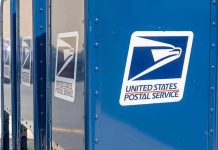 USPS Collapse Imminent — Stamps Skyrocket! Blue USPS mail collection boxes in a row.
