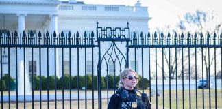 Security Breach Near White House: Gunfire Erupts Secret Service agent stands guard outside the White House.