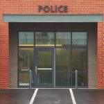 Entrance of a modern police station with brick facade