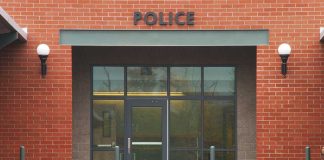 Entrance of a modern police station with brick facade