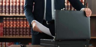 The Home Repair Scam Ring DHS Describes — And the Death That Exposed It Gavel, lawyer, briefcase, and legal books on the table.