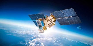 Satellite with solar panels orbiting above Earth