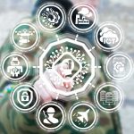 Person in camouflage touches virtual interface with cybersecurity and technology icons