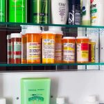 Medicine cabinet with prescription bottles and toiletries
