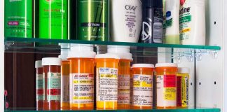 Medicaid Bombshell Freezes Teen Care Medicine cabinet with prescription bottles and toiletries