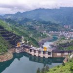 Hydroelectric dam in a green mountain valley