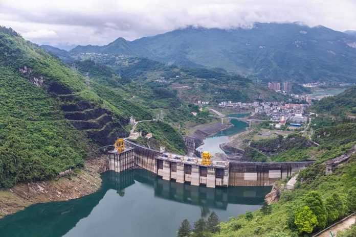 Hydroelectric dam in a green mountain valley