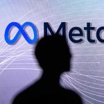 silhouette in front of Meta logo on screen