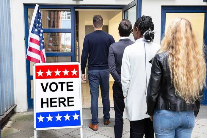 shutterstock_1522522559 Voters standing in line at a polling place entrance