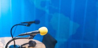 Podcast studio microphones on a desk