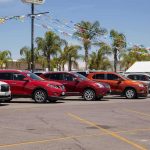 row of SUVs at a car dealership lot