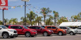 row of SUVs at a car dealership lot