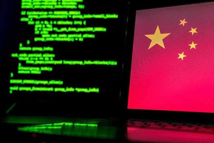 Laptop screen with Chinese flag beside green computer code
