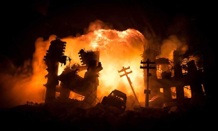 City ruins ablaze with a massive explosion behind collapsed buildings