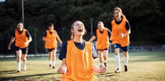 Female Olympians Push Back On Sydney Sweeney Ad Soccer player kneeling and celebrating on field