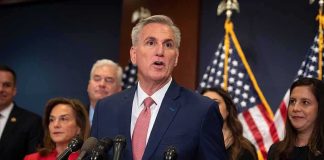 Kevin McCarthy speaks at a podium with Elise Stefanik, Tom Emmer, and Richard Hudson behind him