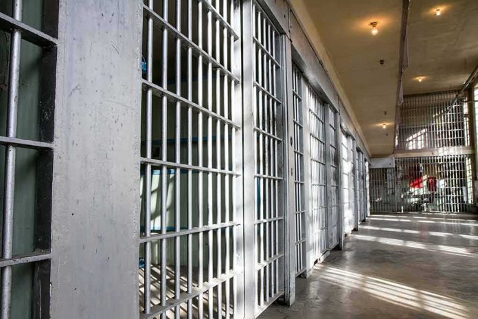 Prison cell block with metal bars and corridor