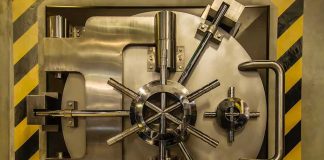 Vault door with steel locking wheel and handle