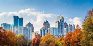 City skyline behind a park with autumn trees