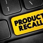Keyboard key labeled product recall in bright yellow